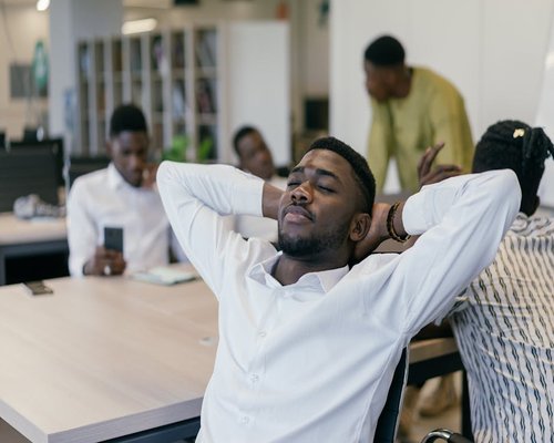Corporate office worker taking a break looking away from screen
